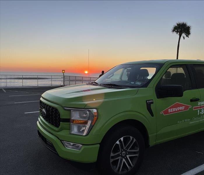 SERVPRO truck in front of a sunset.