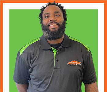 Grant, servpro employee against a green background, man